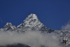 Mighty Ama-Dablam soaring above clouds